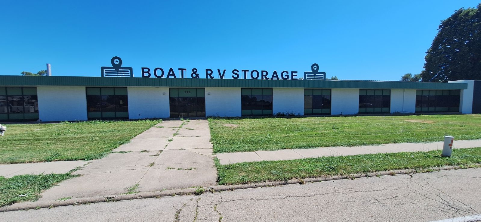 Front View of Bon Voyage Storage with the Words boat and RV Storage atop the roof. 